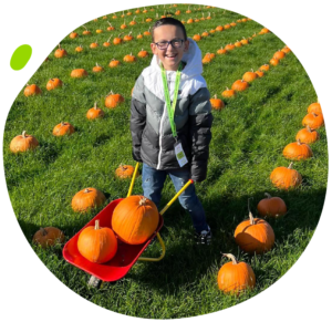 Ronni in a pumpkin field at the My Mito Mission Meetup in 2022